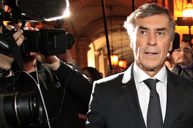 
              FILE - In this Feb.8, 2016 file photo, former French budget minister Jerome Cahuzac arrives for his trial in Paris. Cahuzac appears in a Paris court Monday Sept. 5, 2016 on charges of tax fraud and money laundering that forced him to resign in 2013 in one of the biggest political scandals under President Francois Hollande. (AP Photo/Thibault Camus)
            