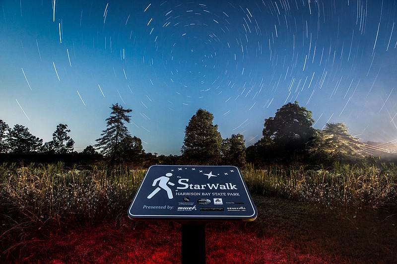 Stars wheel in streaks over Harrison Bay State Park in a long-exposure photograph by astrophotographer Matt Harbison. The park will celebrate the grand opening of the Star Walk, a self-guided walking path and astronomical observation tour, on Saturday, Sept. 10.