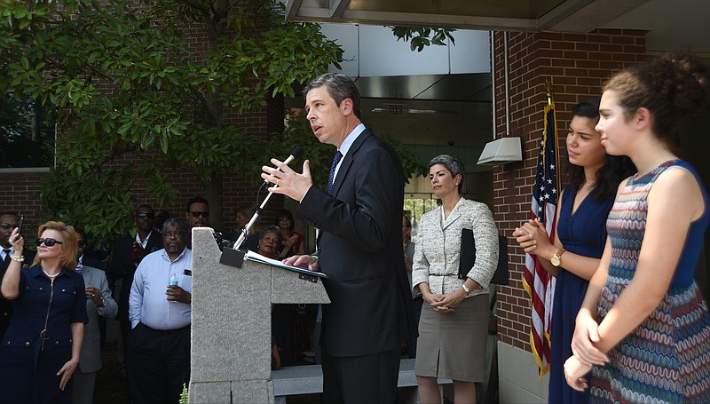 Mayor Andy Berke announces Monday, Sept. 6, 2016 at the Development Resource Center that he will be running for re-election as wife Monique, and daughters Hannah and Orly, from left, look on.