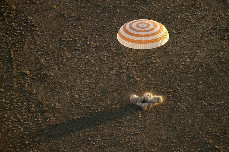 
              This photo provided by NASA shows the Soyuz TMA-20M spacecraft as it lands with Expedition 48 crew members NASA astronaut Jeff Williams, Russian cosmonauts Alexey Ovchinin, and Oleg Skripochka of Roscosmos near the town of Zhezkazgan, Kazakhstan, Wednesday, Sept. 7, 2016. A record-setting American and two Russians landed safely back on Earth Wednesday after a six-month mission aboard the International Space Station. (Bill Ingalls/NASA via AP)
            