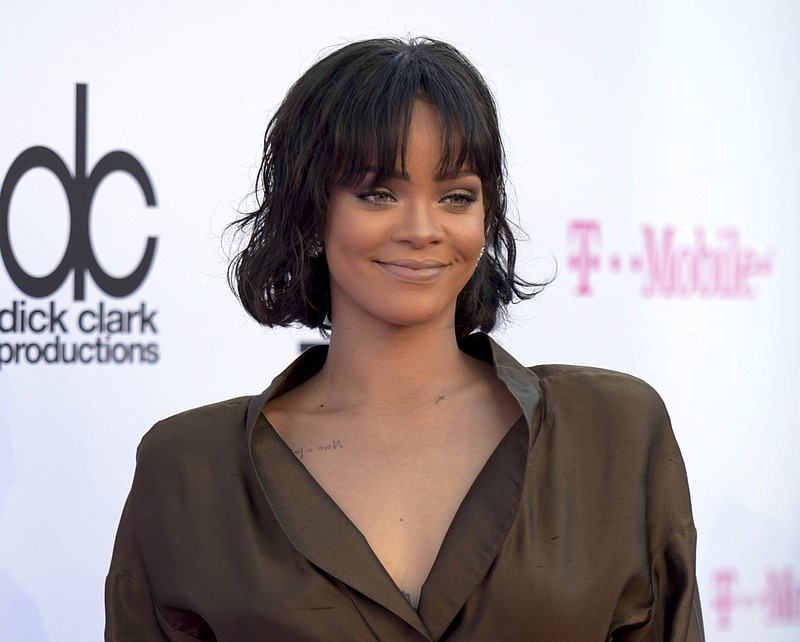 
              FILE - In this May 22, 2016 file photo, Rihanna arrives at the Billboard Music Awards in Las Vegas. Rihanna says her new collection for Puma was inspired by Japanese street culture. The pop star launched the autumn/winter 2016 Fenty Puma by Rihanna line on Tuesday, Sept. 6, 2016 at Foot Locker in New York City. (Photo by Richard Shotwell/Invision/AP, File)
            