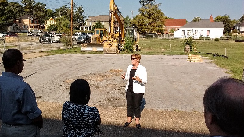 CNE President and CEO Martina Guilfoil speaks at Tuesday's groundbreaking for the Mai Bell, a new, 49-unit apartment complex.