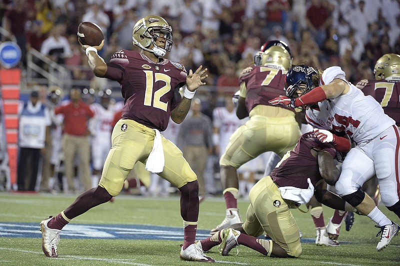 Florida State quarterback Deondre Francois (12) throws a pass as he is rushed by Mississippi linebacker Alex Ashlock (44) during the first half of an NCAA college football game in Orlando, Fla., Monday, Sept. 5, 2016.