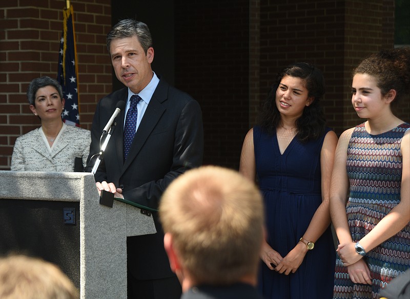Chattanooga Mayor Andy Berke, accompanied by his wife, Monique, left, and daughters Hannah and Orly, announces his bid for a second term at the Development Resource Center earlier this week.