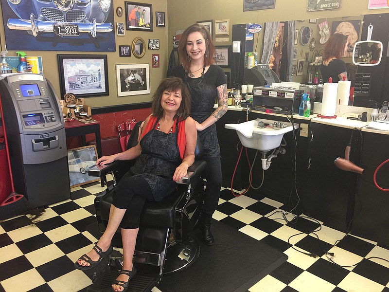 Brenda Wallace (seated) and Lauren "Tootsie" Bullard were photographed in the Cloverleaf Barber Shop on Hixson Pike.