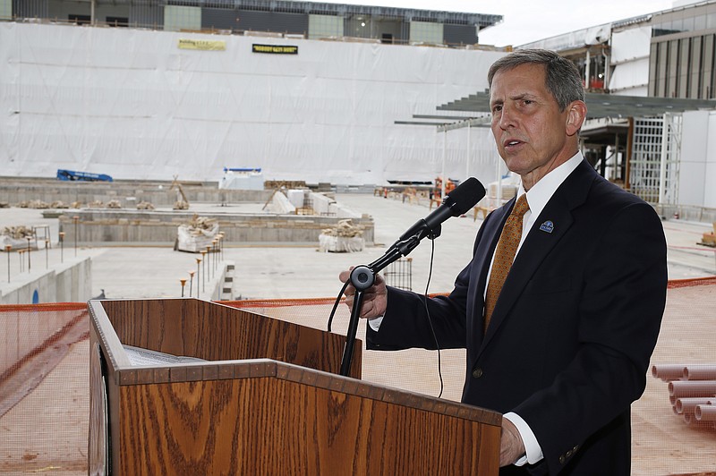 
              FILE - In this July 1, 2015 file photo, Veterans Affairs Deputy Secretary Sloan Gibson speaks near construction for the VA hospital during a news conference, in Aurora, Colo. A House committee will vote on whether to issue a subpoena to the Veterans Affairs Department demanding the agency turn over documents that could explain how the cost of a Denver-area VA hospital ballooned to almost $1.7 billion, nearly triple earlier estimates. The Veterans Affairs Committee scheduled a vote for Wednesday, Sept. 7, 2016, on a subpoena for documents gathered by a VA internal inquiry called an administrative investigation board. (AP Photo/David Zalubowski, File)
            