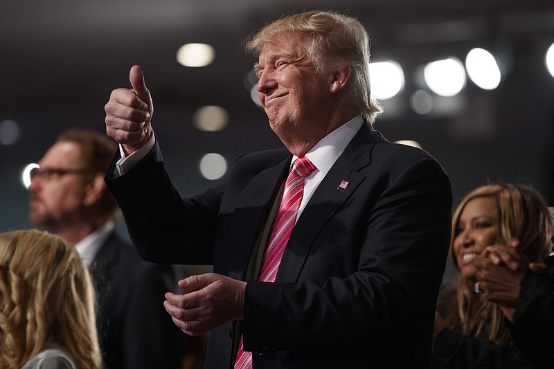 Republican presidential candidate Donald Trump gives a thumbs up in Detroit. (AP Photo/Evan Vucci)