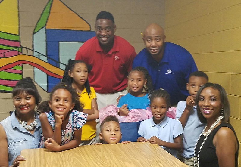 The two ladies in the picture are Deidre Clack and LaTrice Currie. The staff is Orlando Lightfoot and Reggie Jackson (left to right for both)