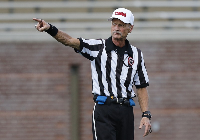 Referee Billy Fairbanks officiates a prep football jamboree game at Finley Stadium on Saturday, Aug. 12, 2016, in Chattanooga, Tenn.