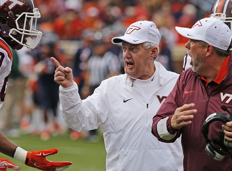 Former Virginia Tech head football coach Frank Beamer, shown here getting upset with a player during last November's win over Virginia, has encountered much more family time in retirement.