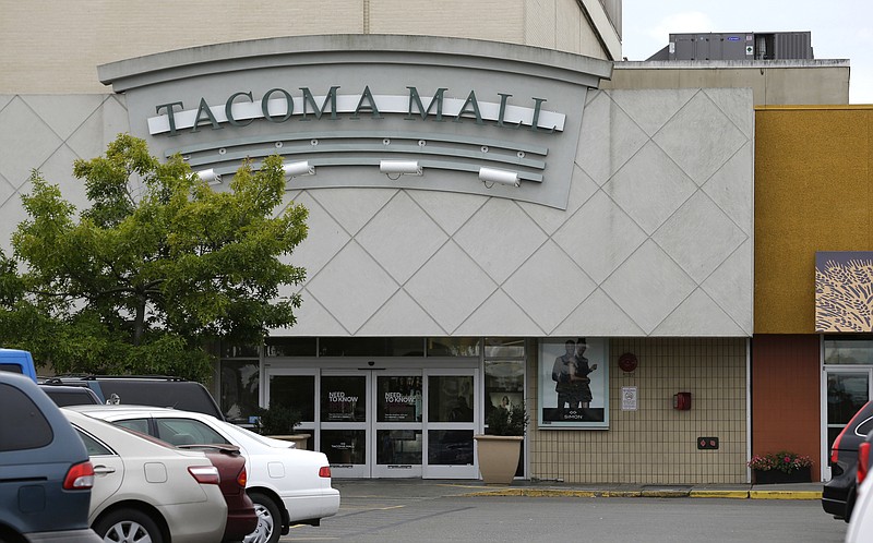 
              Cars are parked near an entrance to the Tacoma Mall, Wednesday, Sept. 7, 2016, in Tacoma, Wash. A Washington state teenager who was riding her bicycle through the mall parking lot when an off-duty officer working as a security guard threw her to the ground and shocked her with a stun gun is suing the Tacoma Police Department. (AP Photo/Ted S. Warren)
            