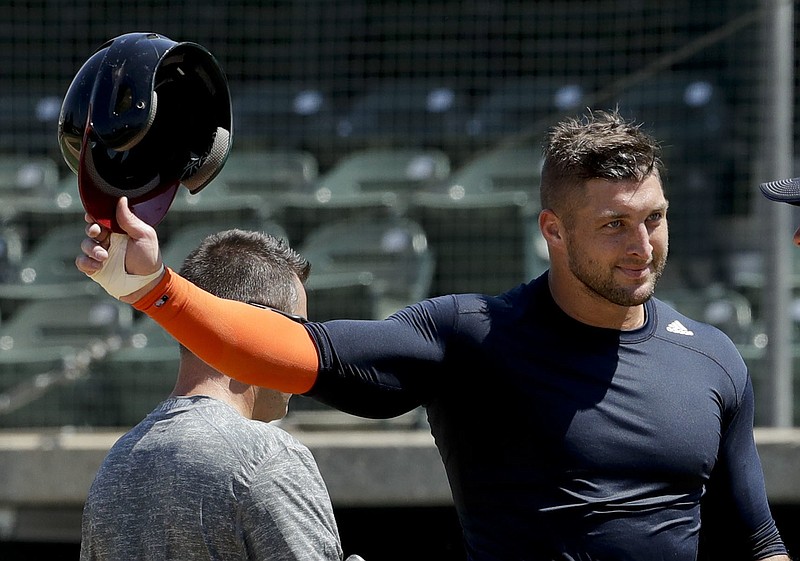 In this Aug. 30, 2016, file photo, former NFL quarterback Tim Tebow finishes his work out for baseball scouts and the media in Los Angeles. Tebow has signed a minor league contract with the New York Mets. The Mets announced Thursday, Sept. 8, 2016, that the former quarterback will take part in the Instructional League in Port St. Lucie, Florida.(AP Photo/Chris Carlson, File)