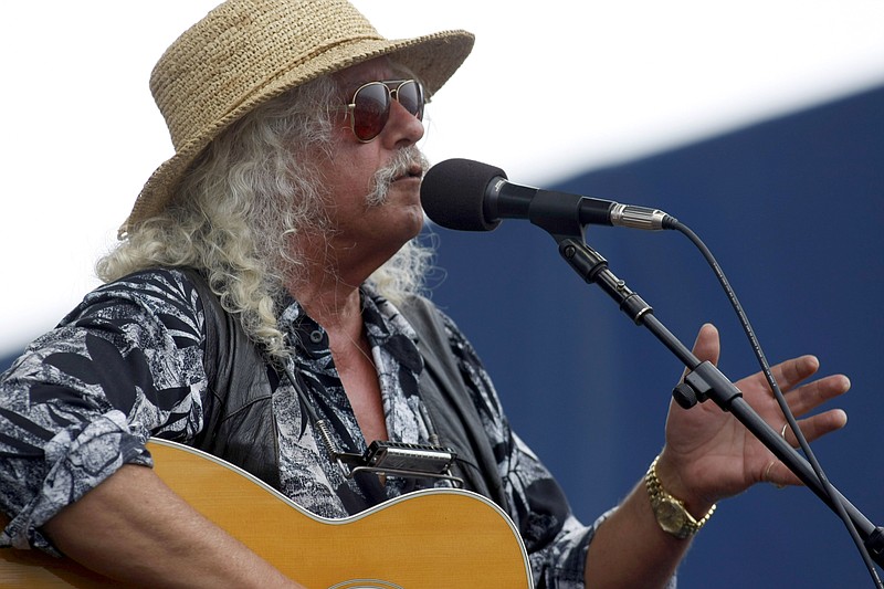 In this Aug. 2, 2009, file photo, Arlo Guthrie performs at George Wein's Newport Folk Festival in Newport, R.I.