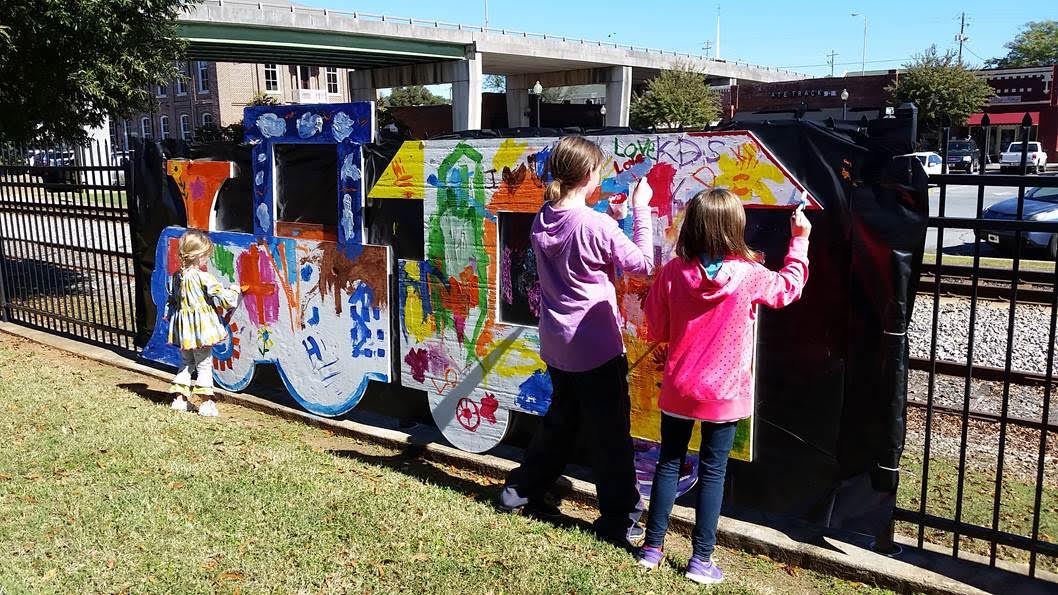 Children help create artwork in downtown Cartersville.