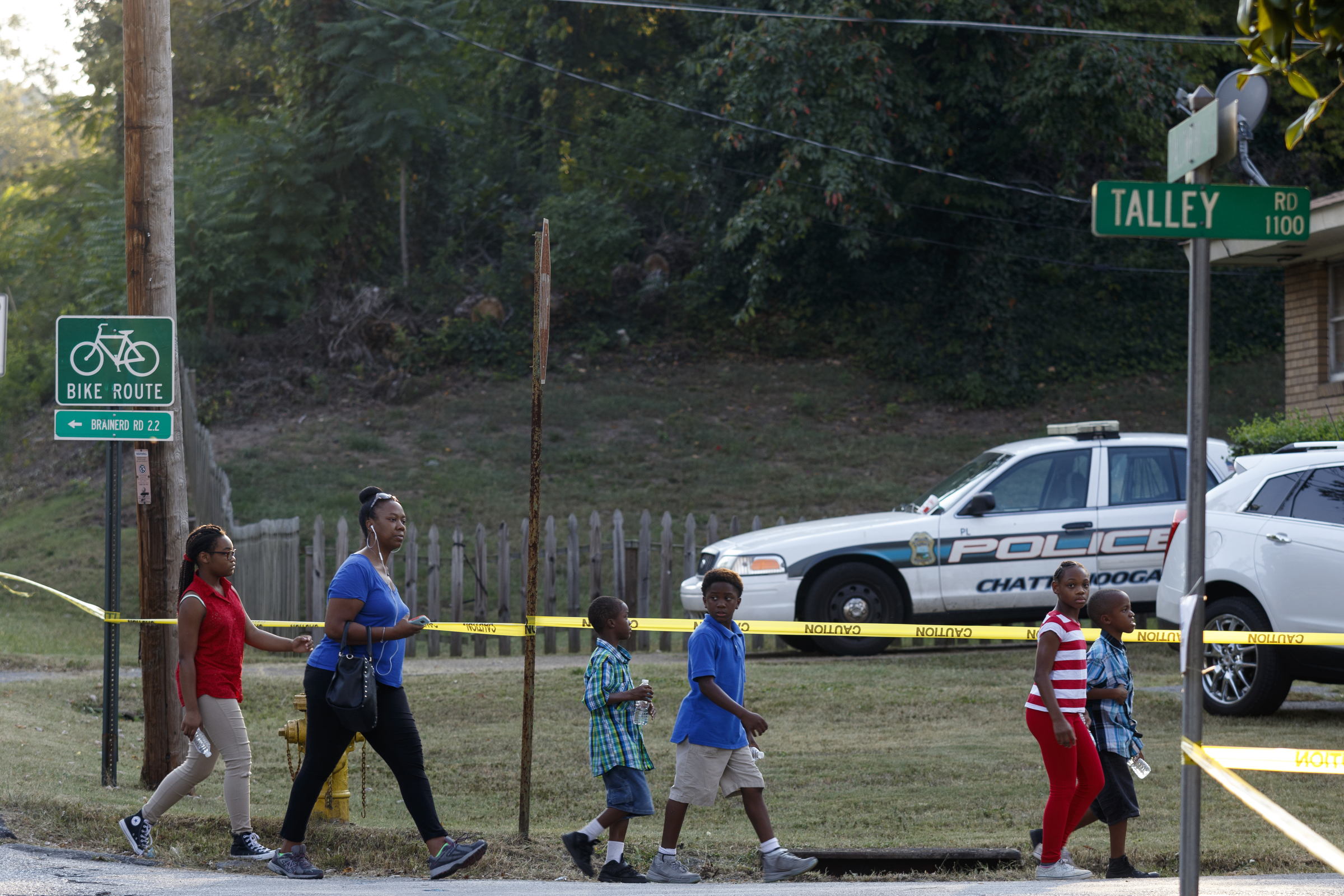 Fans walk into the nearby neighborhood after Shallowford Road was blocked before a performance by artist Usher at Dalewood Middle School, his former school, on Friday, Sept. 9, 2016, in Chattanooga, Tenn. The concert concluded a string of activities and benefits by the artist in his home town.