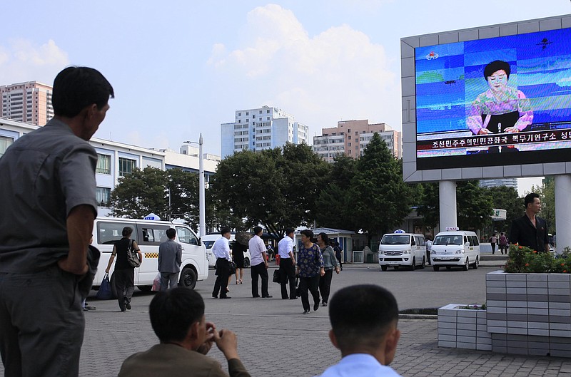 
              North Koreans watch a news report regarding a nuclear test on a large screen outside the Pyongyang Station in Pyongyang, North Korea, Friday, Sept. 9, 2016. North Korea said Friday it conducted a "higher level" nuclear warhead test explosion, which it trumpeted as finally allowing it to build "at will" an array of stronger, smaller and lighter nuclear weapons. (AP Photo/Jon Chol Jin)
            