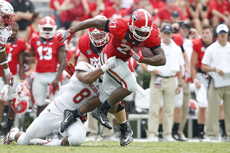 Nicholls defensive lineman Terrell Encalade (87) tackles Georgia running back Nick Chubb (27) in the second half of an NCAA college football game Saturday, Sept. 10, 2016, in Athens, Ga. Georgia won 26-24. (AP Photo/Brett Davis)