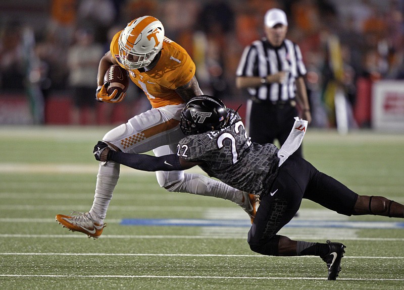 Tennessee running back Jalen Hurd (1) is hit by Virginia Tech linebacker Terrell Edmunds (22) during the first half of an NCAA college football game at Bristol Motor Speedway Saturday, Sept. 10, 2016 in Bristol, Tenn. (AP Photo/Wade Payne)