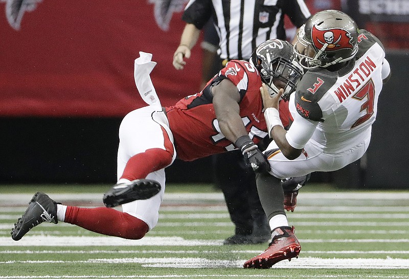 
              Atlanta Falcons outside linebacker Deion Jones (45) hits Tampa Bay Buccaneers quarterback Jameis Winston (3) during the first half of an NFL football game, Sunday, Sept. 11, 2016, in Atlanta. (AP Photo/David Goldman)
            