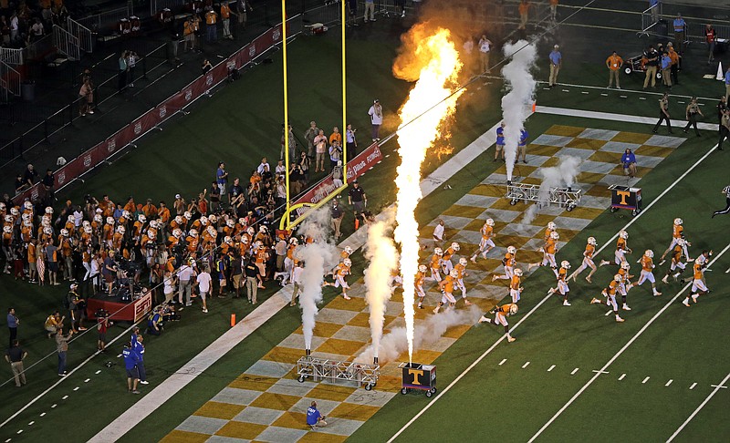 Tennessee players take the field before an NCAA college football game against Virginia Tech at Bristol Motor Speedway on Saturday, Sept. 10, 2016, in Bristol, Tenn. (AP Photo/Mark Humphrey)