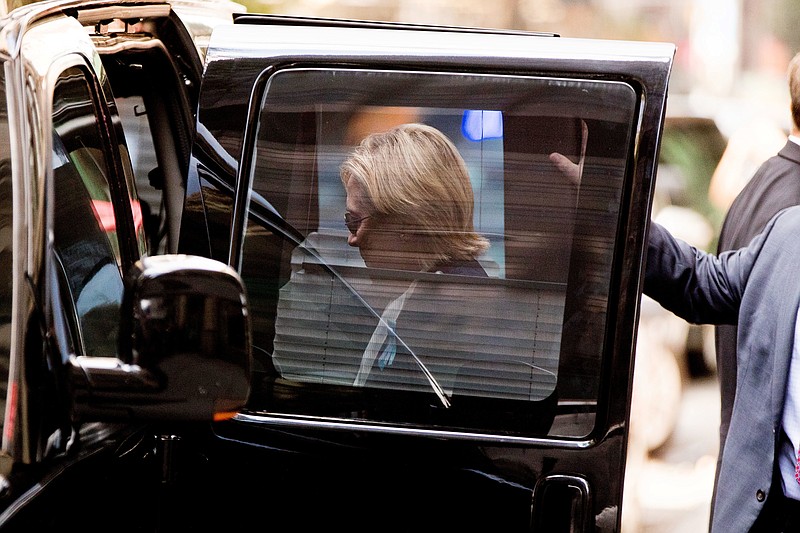 Democratic presidential candidate Hillary Clinton gets into a van as she leaves an apartment building Sunday, Sept. 11, 2016, in New York. Clinton's campaign said the Democratic presidential nominee left the 9/11 anniversary ceremony in New York early after feeling "overheated." (AP Photo/Andrew Harnik)