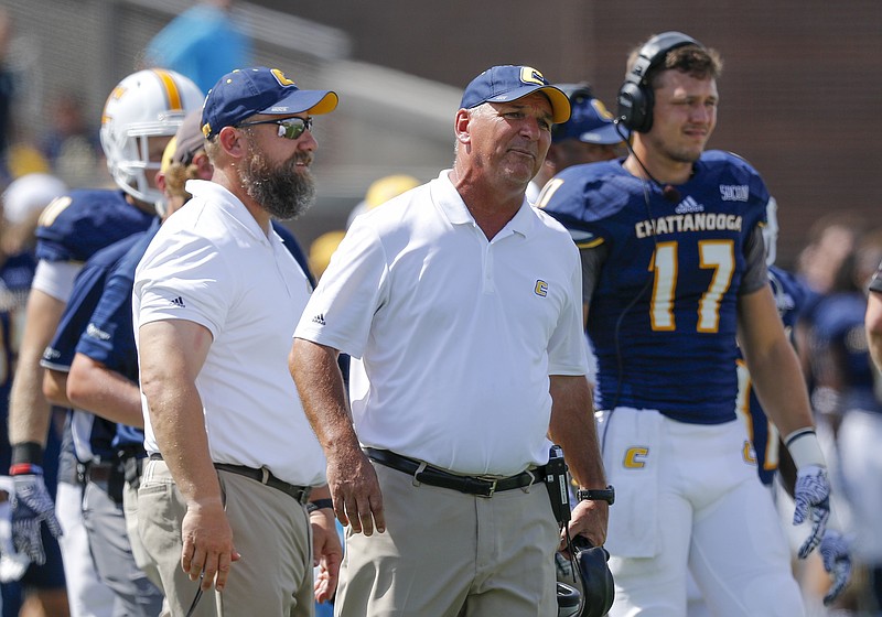 UTC football coach Russ Huesman, center, says his fourth-ranked Mocs will "get tested against Furman."