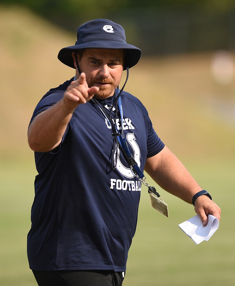 Coach Chad Barger directs practice Tuesday, July 26, 2016 at Coahulla Creek High School.