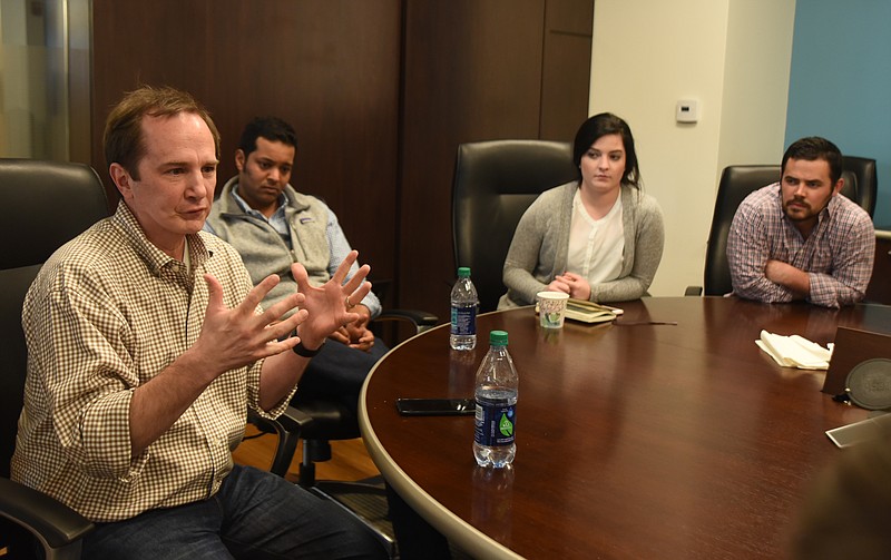 Barry Large, Santosh Sankar, Rachel Hanson and Weston Wamp, from left, talk Monday, March 28, 2016 in the Lamp Post office.