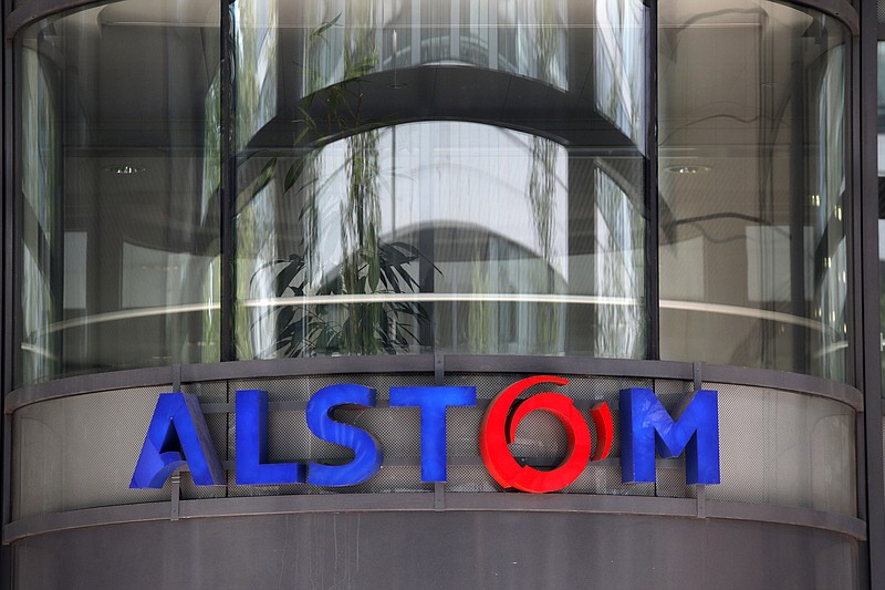 
              FILE - This Wednesday, April 30, 2014 file photo shows the company logo of Alstom at the headquarters of the leading global maker of high-speed trains, power plants and grids, in Levallois-Perret, outside Paris, France. France’s Socialist government vows to maintain the train making site of rail giant Alstom in the country despite the company’s decision to end its production. (AP Photo/Christophe Ena, File)
            