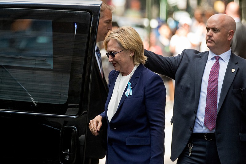 
              Democratic presidential candidate Hillary Clinton gets into a van as she leaves an apartment building Sunday, Sept. 11, 2016, in New York. Clinton's campaign said the Democratic presidential nominee left the 9/11 anniversary ceremony in New York early after feeling "overheated." (AP Photo/Andrew Harnik)
            