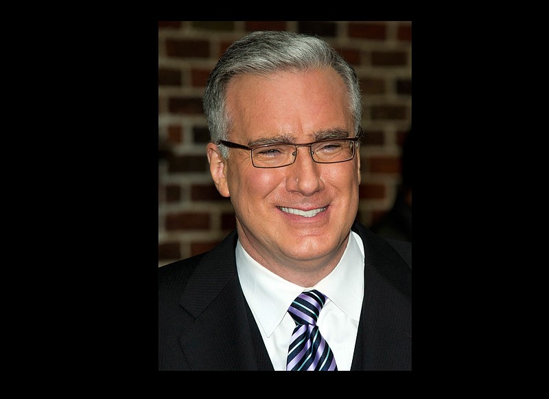 
              FILE - In this Oct. 24, 2011 file photo, political pundit Keith Olbermann leaves a taping of the "Late Show with David Letterman," in New York. GQ magazine said Monday, Sept. 12, 2016, that it has named tOlberman as a special correspondent. Starting Tuesday, he will air a web series on GQ.com twice a week on the 2016 election and other news topics. (AP Photo/Charles Sykes, file)
            