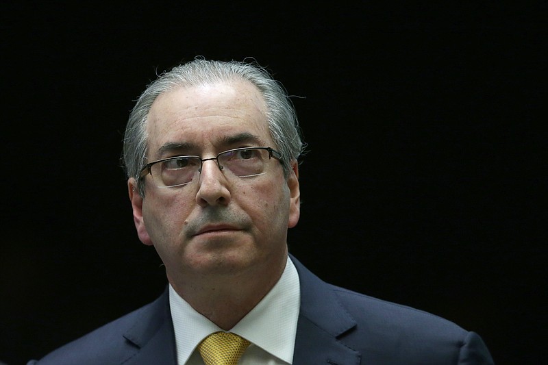 
              Brazil's former President of the Chamber of Deputies Eduardo Cunha takes a break during the presentation of his defense in the Chamber of Deputies, in Brasilia, Brazil, Monday, Sept. 12, 2016. Prosecutors accuse Cunha of corruption and money laundering for his role in negotiating contracts for drill ships and say he received an illegal payment of $5 million. (AP Photo/Eraldo Peres)
            