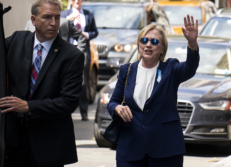 
              Democratic presidential candidate Hillary Clinton walks from her daughter's apartment building Sunday, Sept. 11, 2016, in New York. Clinton unexpectedly left Sunday's 9/11 anniversary ceremony in New York after feeling "overheated," according to her campaign. (AP Photo/Craig Ruttle)
            