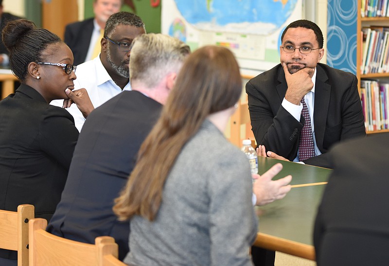 U.S. Secretary of Education John King listens to concerns of first year principals in the library at Battle Academy on Tuesday, Sept. 13, 2016.