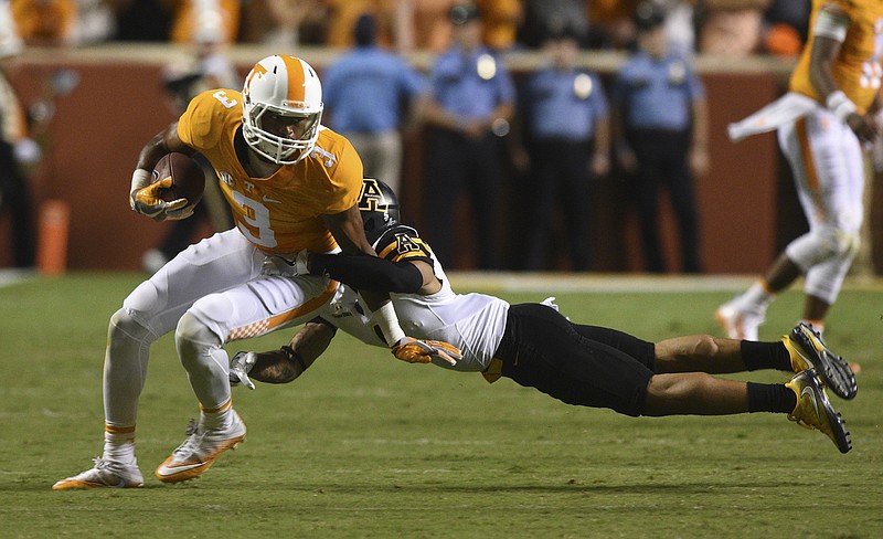 UT's Josh Malone (3) is tackled by Appalachian State's Mondo Williams (4) Thursday, Sept. 1, 2016 in Neyland Stadium.