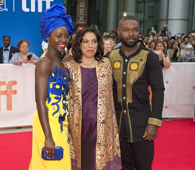 
              Lupita Nyong'o, Mira Nair and David Oyelowo pose for photos as they arrive for "Queen of Katwe" at the 2016 Toronto International Film Festival in Toronto on Saturday, Sept. 10, 2016.  (Frank Gunn/The Canadian Press via AP)
            