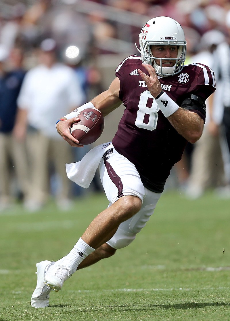 Texas A&M quarterback Trevor Knight (8) scrambles for a first down against Prairie View during the second half of an NCAA college football game Saturday, Sept. 10, 2016, in College Station, Texas. (AP Photo/Sam Craft)