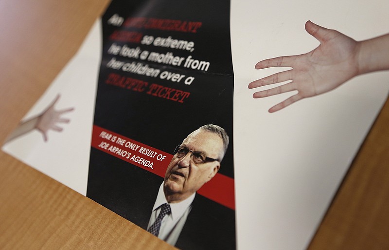 
              A group backed by the New York hedge fund billionaire George Soros, a longtime bankroller of liberal political causes, is mailing anti-Joe Arpaio fliers to Phoenix-area voters shown here, Tuesday, Sept. 13, 2016, in Phoenix. Paul Penzone, a former Phoenix police sergeant running against Arpaio, is getting a boost from the unlikely Soros source. (AP Photo/Ross D. Franklin)
            