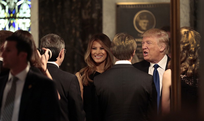 
              Republican presidential candidate Donald Trump and his wife Melania meet with family members of Phyllis Schlafly before the start of a funeral Mass for Schlafly, Saturday, Sept. 10, 2016, in St. Louis. Schlafly, the outspoken conservative activist who helped defeat the Equal Rights Amendment in the 1970s and founded the Eagle Forum political group, died Monday at the age of 92. (Robert Cohen/St. Louis Post-Dispatch via AP, Pool)
            