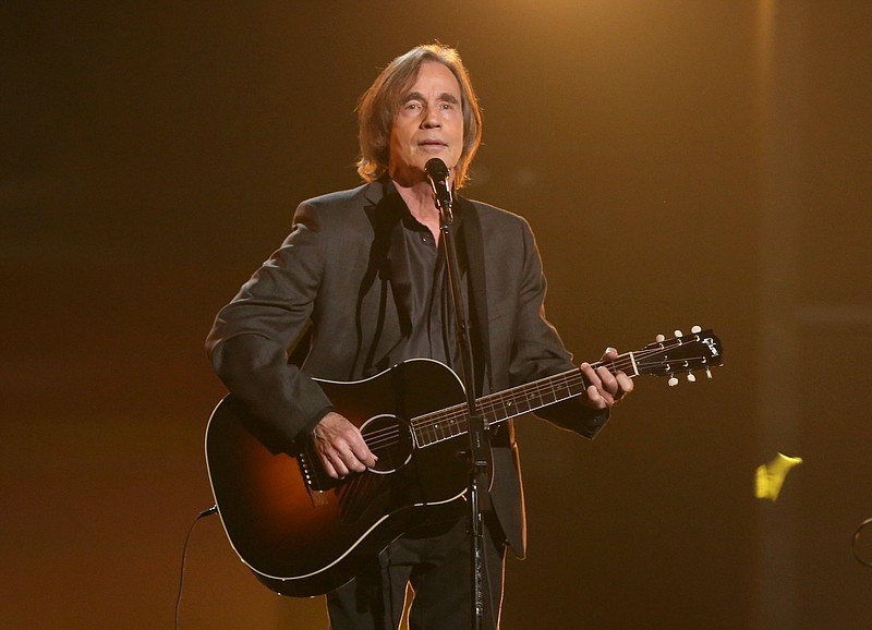 
              FILE - In this Feb. 15, 2016 file photo, Jackson Browne performs "Take It Easy" during a tribute to Glenn Frey at the 58th annual Grammy Awards in Los Angeles. Browne, Eddie Vedder and Roseanne Cash will headline at New York’s Beacon Theatre as part of the livestreamed Concert Across America to End Gun Violence. Organizers said Thursday, Sept. 15, it’s one of the Sept. 25 events featuring more than 1,000 artists at 250 venues across the U.S. (Photo by Matt Sayles/Invision/AP, File)
            