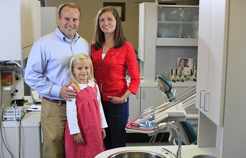 Drs. Mark and Ellen McOmie and their daughter Claire