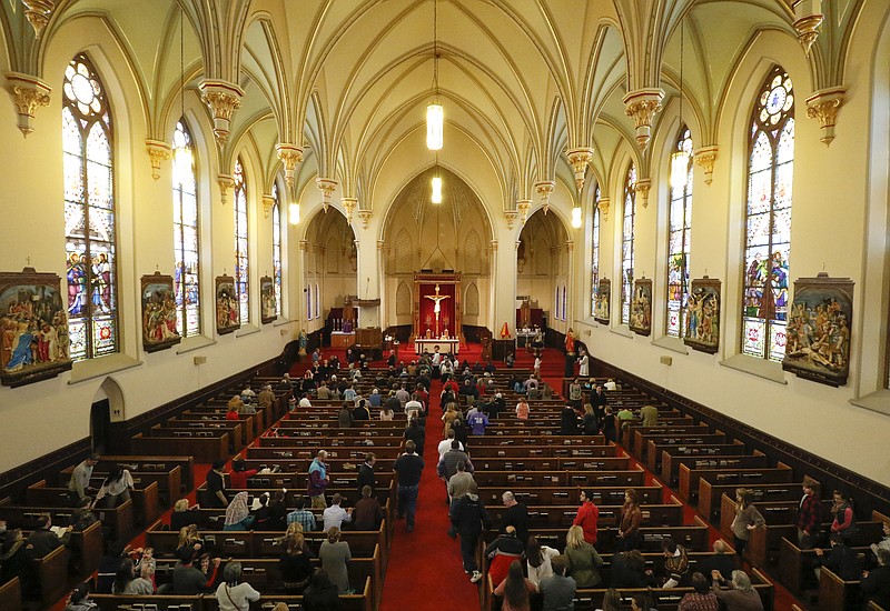 Staff Photo by Dan Henry / The Chattanooga Times Free Press- 2/10/16. Parishioners attend an Ash Wednesday mass at The Basilica of Sts. Peter & Paul in downtown Chattanooga on February 10, 2016. 