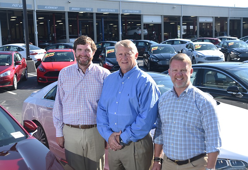 Austin Watson, Don Thomas and Clay Watson, from left, stand in the lot of Mountain View Ford Monday, September 12, 2016.