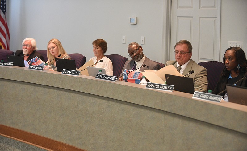 School board members study information packets during their meeting Thursday, September 15, 2016 at the Hamilton County Department of Education.