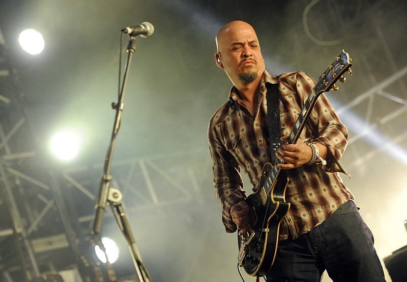 
              FILE - In this April 12, 2014 file photo, Joey Santiago of The Pixies performs at the 2014 Coachella Music and Arts Festival  in Indio, Calif.  Santiago has checked into a rehabilitation center for drug and alcohol issues. His Pixies band mates Black Francis, David Lovering and Paz Lenchantin said in a statement Friday, Sept. 16, 2016 that Santiago will be in a rehab center for “at least 30 days.” No more details were provided.(Photo by Chris Pizzello/Invision/AP)
            
