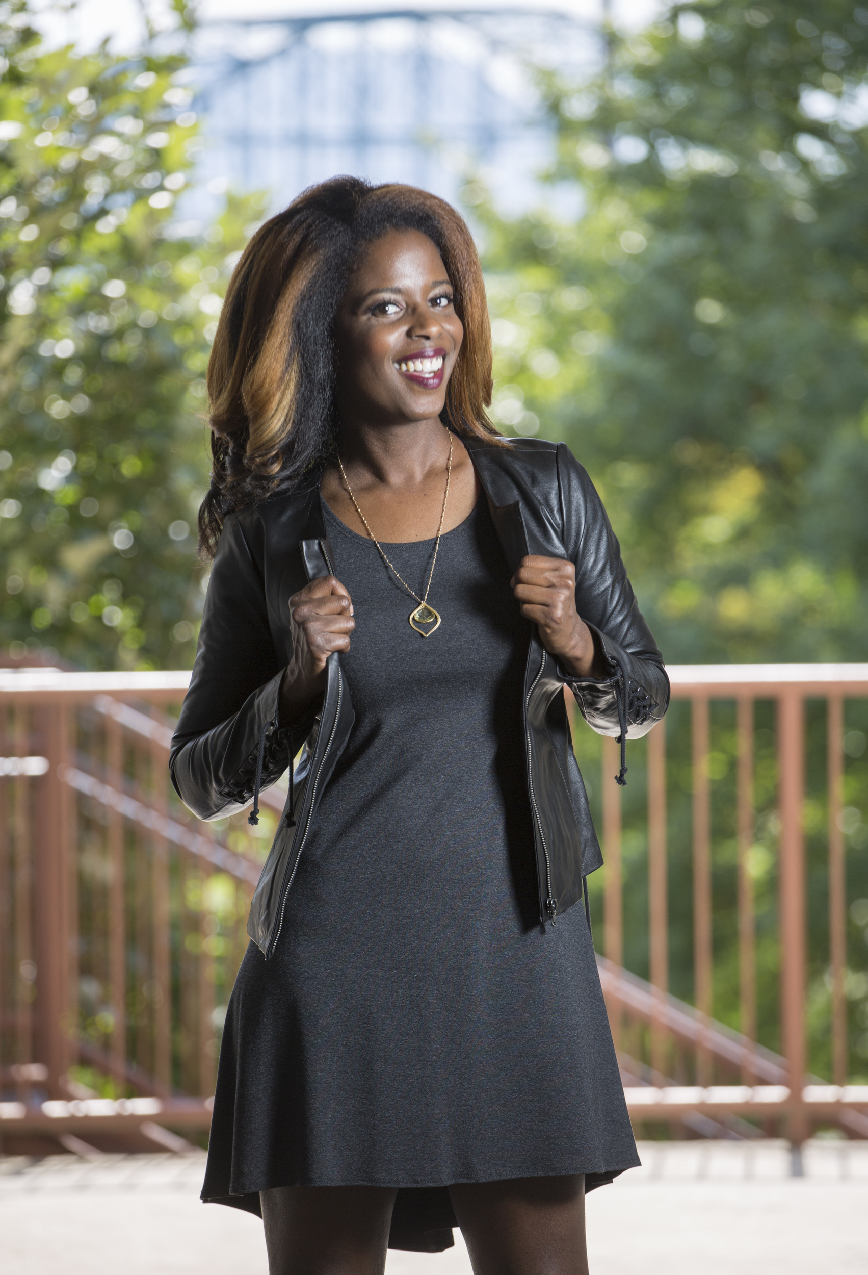 Staff Photo by Dan Henry / The Chattanooga Times Free Press- 9/13/16. Lorean Mays models fall fashion outfits styled by Suzanne West, owner of Frankie & Julien's, located in North Chattanooga. Mays is wearing a Only Hearts charcoal grey