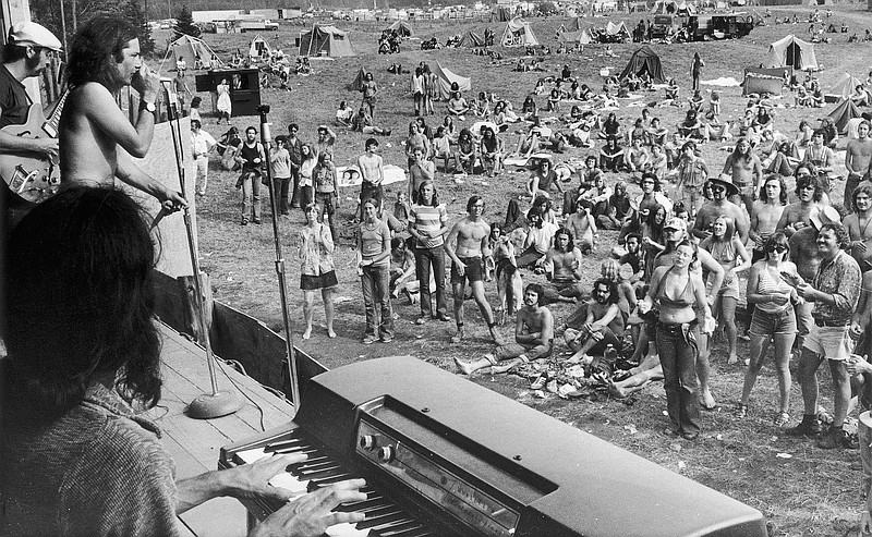 
              FILE - In this Sept. 1, 1973 file photo, a rock band plays before concert goers on the opening day of a rock festival in Holland, Vt., that attracted a thousands of young people over the three-day Labor Day weekend. The Vermont Historical Society's exhibit 'Freaks, Radicals & Hippies: Counterculture in the 1970s in Vermont' opens at the Vermont History Center in Barre, Vt. on Sept. 24, 2016. The exhibit will showcase how the state became a hotbed for the counterculture as the influx of young people had a lasting influence on the state's politics, agriculture, food and offbeat culture. (AP Photo, File)
            