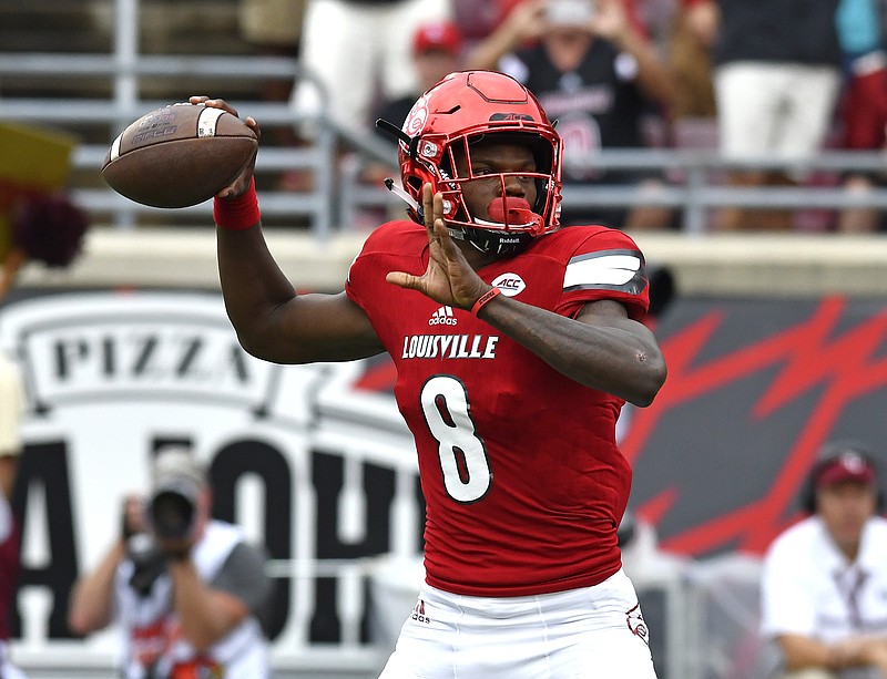 
              Louisville quarterback Lamar Jackson looks for a receiver during the first quarter of an NCAA college football game against Florida State, Saturday, Sep. 17, 2016 in Louisville Ky. (AP Photo/Timothy D. Easley)
            