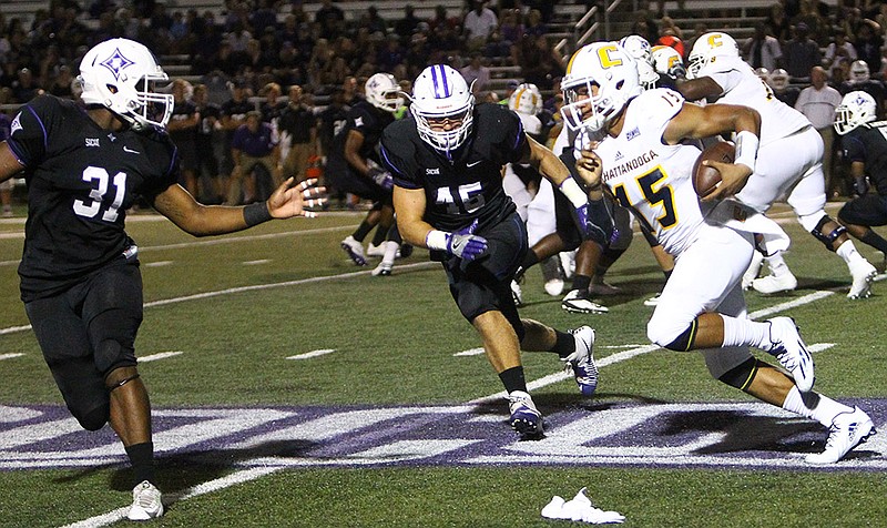 UTC quarterback Alejandro Bennifield, with ball, helped lead the Mocs to a 21-14 win at Furman in their SoCon opener on Saturday night.