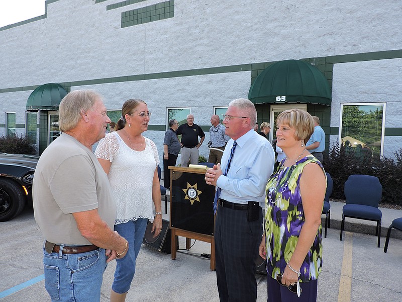 Clockwise from left, Mountain View Estates residents Robert and Debbie Blackwell speak with Walker County Sheriff Steve Wilson and his wife Sandy about how happy they are that the Walker County Sheriff's Satellite Office is finally open.
